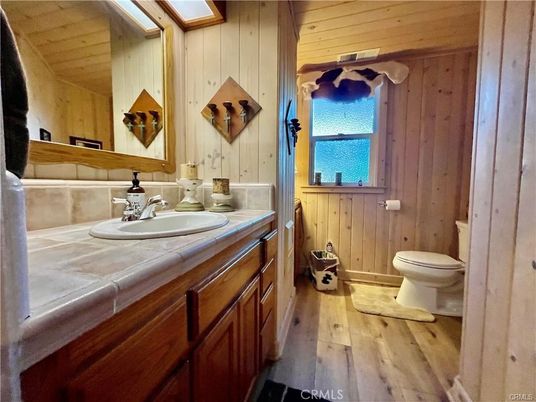 Bathroom, Interior, Tile Countertops, Wood Texture Flooring, Wooden Walls