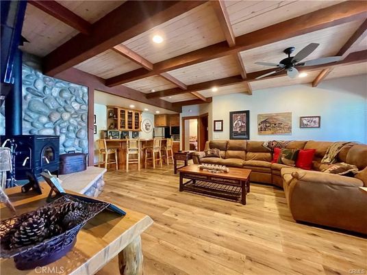 Dining room, Fireplace, Interior, Living room, Recessed Lighting, Stone Walls, Wooden Beams, Wood Texture Flooring
