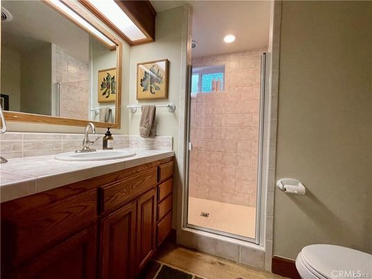Bathroom, Interior, Recessed Lighting, Tile Countertops, Wood Texture Flooring