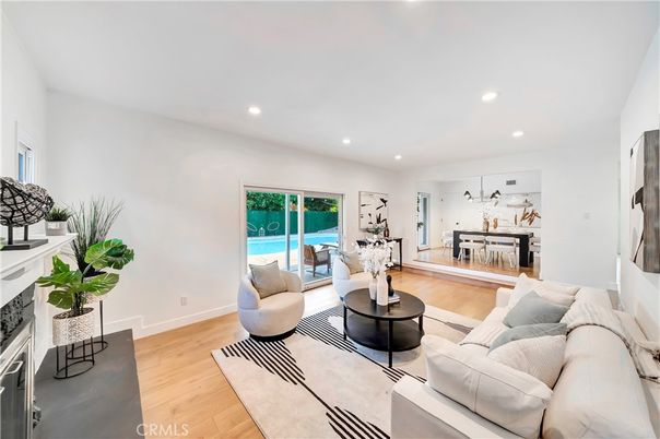 Dining room, Fireplace, Interior, Living room, Recessed Lighting, Wood Texture Flooring