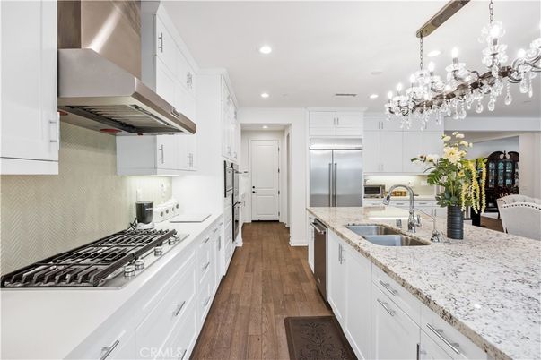 Chandelier, Interior, Kitchen, Recessed Lighting, Stainless Steel Appliances, Wood Texture Flooring