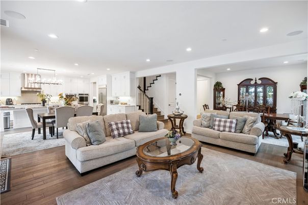 Chandelier, Dining room, Interior, Kitchen, Living room, Pendant Lights, Recessed Lighting, Stainless Steel Appliances, Wood Texture Flooring