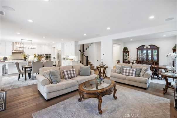 Chandelier, Dining room, Interior, Kitchen, Living room, Pendant Lights, Recessed Lighting, Stainless Steel Appliances, Wood Texture Flooring