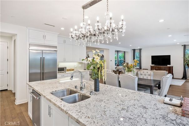 Chandelier, Dining room, Interior, Kitchen, Recessed Lighting, Stainless Steel Appliances, Wood Texture Flooring