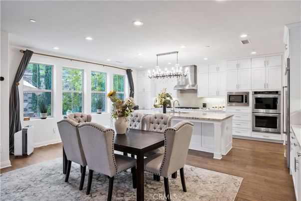 Chandelier, Dining room, Interior, Kitchen, Recessed Lighting, Stainless Steel Appliances, Wood Texture Flooring