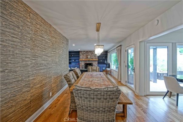 Chandelier, Dining room, Fireplace, Interior, Recessed Lighting, Stone Walls, Wood Texture Flooring