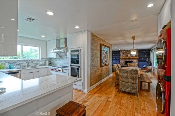 Dining room, Interior, Kitchen, Pendant Lights, Recessed Lighting, Stainless Steel Appliances, Stone Walls, Wood Texture Flooring