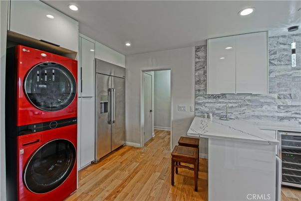Interior, Marble Walls, Recessed Lighting, Utility Closets, Washer, Wood Texture Flooring