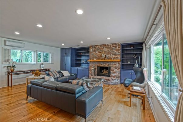 Fireplace, Interior, Living room, Recessed Lighting, Stone Walls, Wood Texture Flooring
