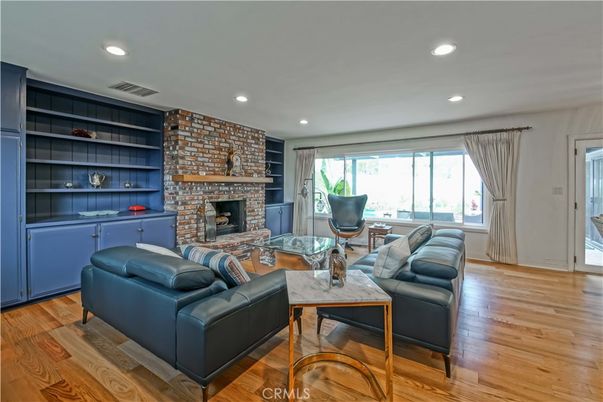 Fireplace, Interior, Living room, Recessed Lighting, Stone Walls, Wood Texture Flooring