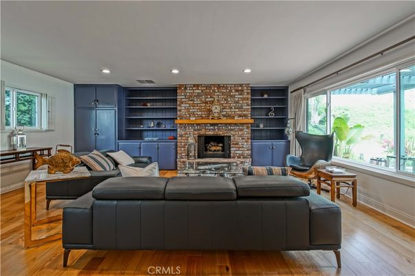 Fireplace, Interior, Living room, Recessed Lighting, Stone Walls, Wood Texture Flooring