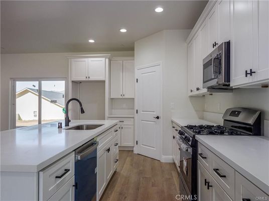 Interior, Kitchen, Recessed Lighting, Stainless Steel Appliances, Wood Texture Flooring