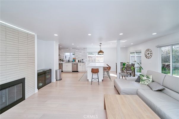 Dining room, Fireplace, Interior, Kitchen, Living room, Pendant Lights, Recessed Lighting, Stainless Steel Appliances, Wood Texture Flooring