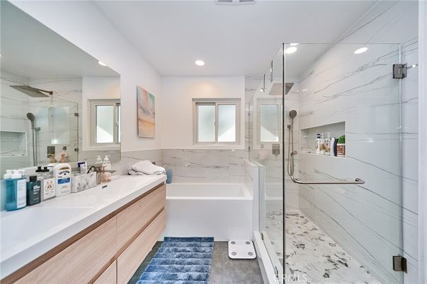 Bathroom, Dual Sink Vanities, Glass Shower, Interior, Marble Walls, Recessed Lighting
