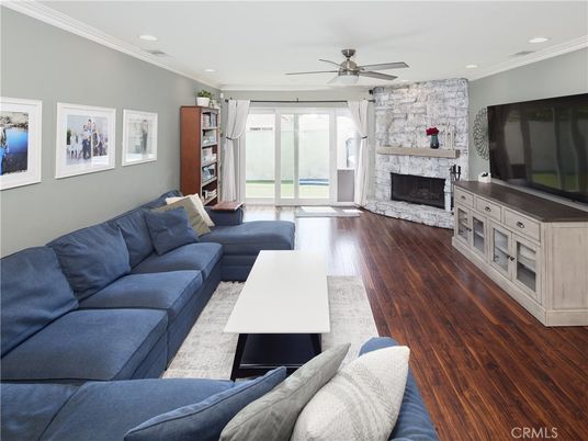 Fireplace, Interior, Living room, Recessed Lighting, Stone Walls, Wood Texture Flooring
