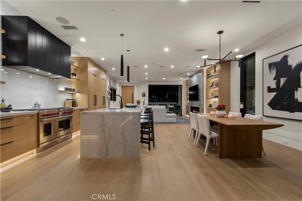 Dining room, Fireplace, Interior, Kitchen, Living room, Marble Walls, Pendant Lights, Recessed Lighting, Stainless Steel Appliances, Wood Texture Flooring
