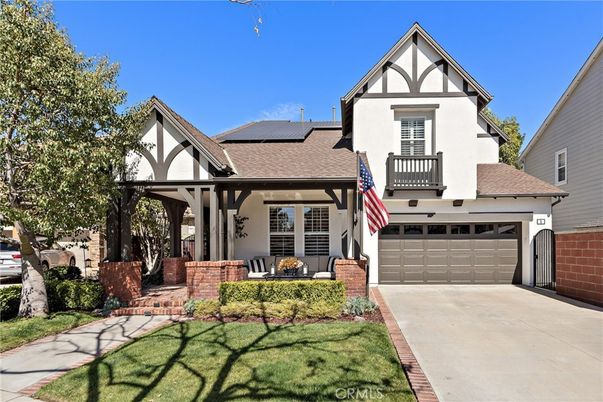 Attached, Exterior, Facade, Solar Panels, Tudor Revival