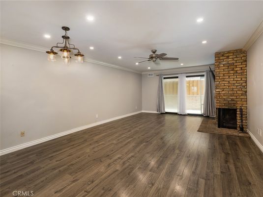 Empty room, Fireplace, Interior, Recessed Lighting, Stone Walls, Wood Texture Flooring