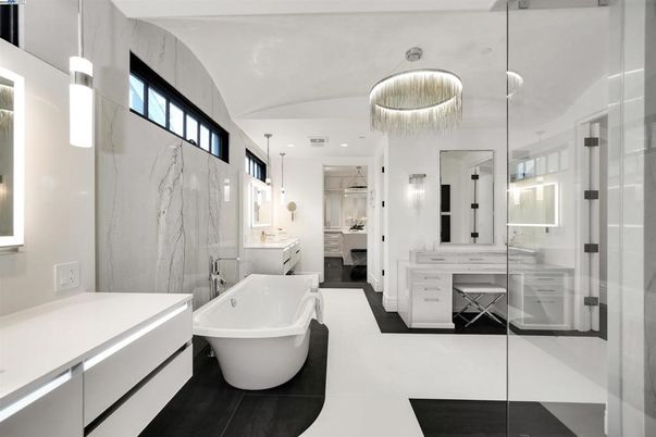 Bathroom, Chandelier, Dual Sink Vanities, Free Standing Baths, Interior, Marble Walls, Pendant Lights, Recessed Lighting