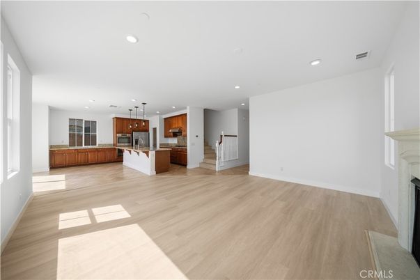 Empty room, Fireplace, Interior, Kitchen, Pendant Lights, Recessed Lighting, Wood Texture Flooring
