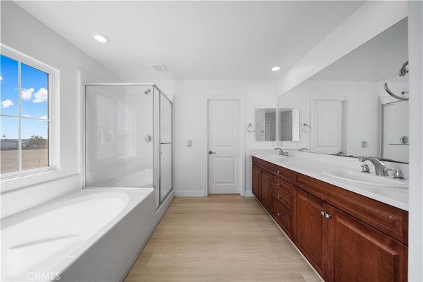 Bathroom, Dual Sink Vanities, Glass Shower, Interior, Recessed Lighting, Wood Texture Flooring