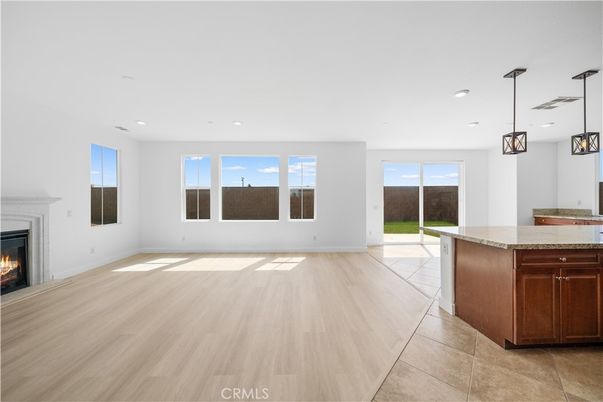 Empty room, Fireplace, Interior, Kitchen, Pendant Lights, Recessed Lighting, Wood Texture Flooring