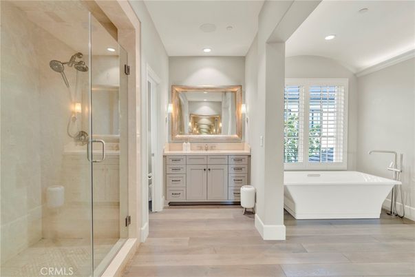 Bathroom, Free Standing Baths, Glass Shower, Interior, Recessed Lighting, Wood Texture Flooring