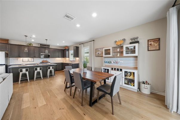 Dining room, Interior, Kitchen, Pendant Lights, Recessed Lighting, Stainless Steel Appliances, Wood Texture Flooring