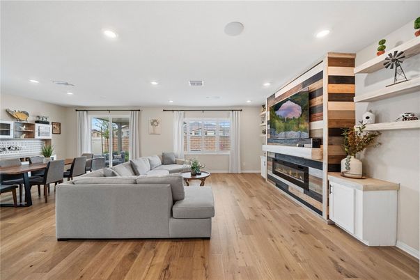 Dining room, Fireplace, Interior, Living room, Pendant Lights, Recessed Lighting, Wood Texture Flooring