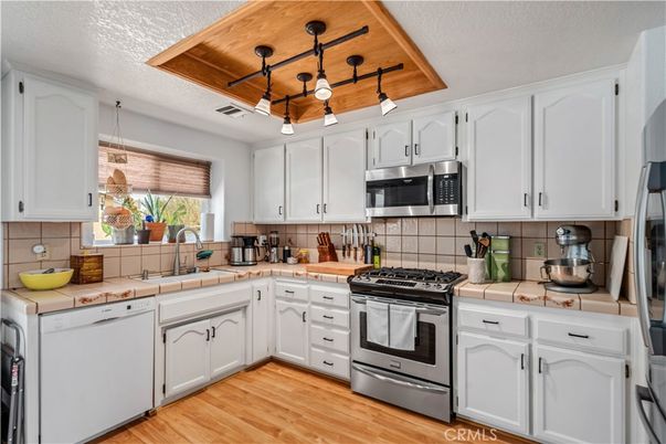 Interior, Kitchen, Pendant Lights, Stainless Steel Appliances, Tile Countertops, Wooden Ceilings, Wood Texture Flooring