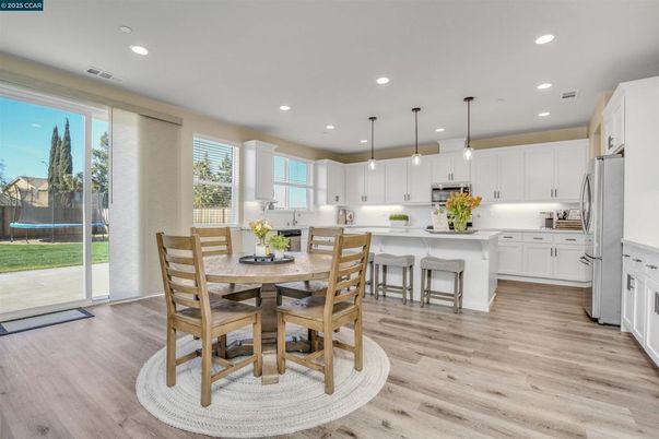 Dining room, Interior, Kitchen, Pendant Lights, Recessed Lighting, Stainless Steel Appliances, Wood Texture Flooring