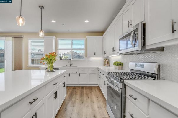 Interior, Kitchen, Pendant Lights, Recessed Lighting, Stainless Steel Appliances, Wood Texture Flooring