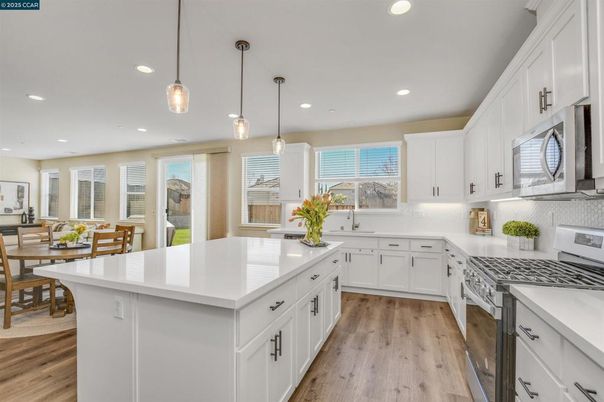 Dining room, Interior, Kitchen, Pendant Lights, Recessed Lighting, Stainless Steel Appliances, Wood Texture Flooring