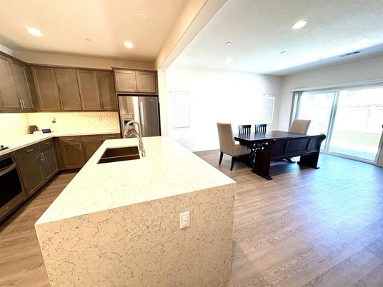 Dining room, Interior, Kitchen, Recessed Lighting, Stainless Steel Appliances, Wood Texture Flooring