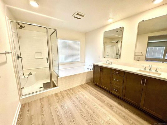 Bathroom, Dual Sink Vanities, Glass Shower, Interior, Recessed Lighting, Wood Texture Flooring