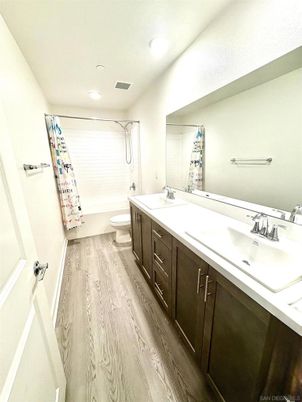 Bathroom, Dual Sink Vanities, Interior, Recessed Lighting, Wood Texture Flooring
