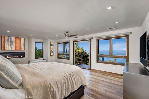 Bedroom, Fireplace, Interior, Recessed Lighting, Water, Wood Texture Flooring