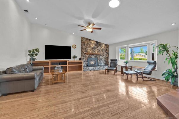 Fireplace, Interior, Living room, Recessed Lighting, Stone Walls, Wood Texture Flooring