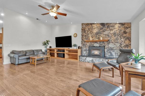 Fireplace, Interior, Living room, Recessed Lighting, Stone Walls, Wood Texture Flooring