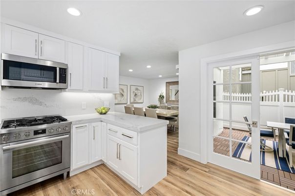 Dining room, Interior, Kitchen, Recessed Lighting, Stainless Steel Appliances, Wood Texture Flooring