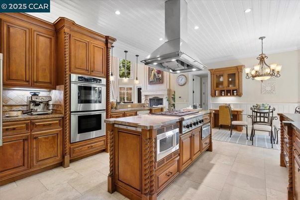 Chandelier, Dining room, Fireplace, Interior, Kitchen, Pendant Lights, Recessed Lighting, Stainless Steel Appliances