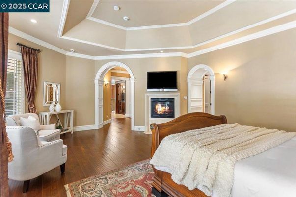 Bedroom, Fireplace, Interior, Recessed Lighting, Wood Texture Flooring