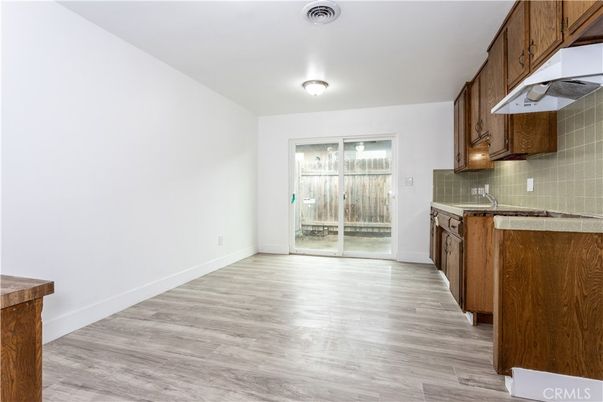 Empty room, Interior, Kitchen, Tile Countertops, Wood Texture Flooring