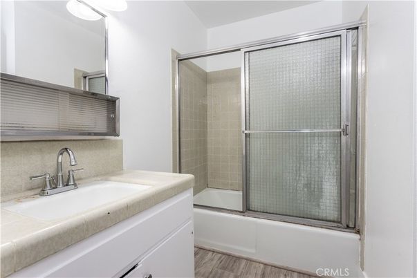 Bathroom, Glass Shower, Interior, Tile Countertops, Wood Texture Flooring