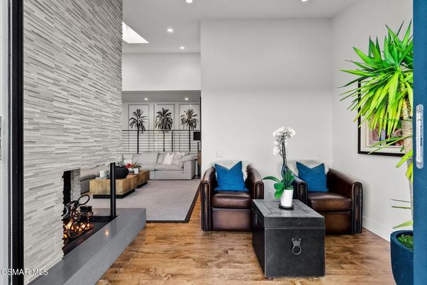 Fireplace, Interior, Living room, Recessed Lighting, Stone Walls, Wood Texture Flooring