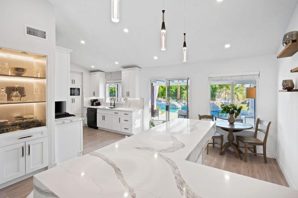 Dining room, Interior, Kitchen, Pendant Lights, Recessed Lighting, Stainless Steel Appliances, Wood Texture Flooring