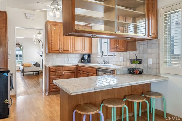 Chandelier, Interior, Kitchen, Tile Countertops, Wood Texture Flooring