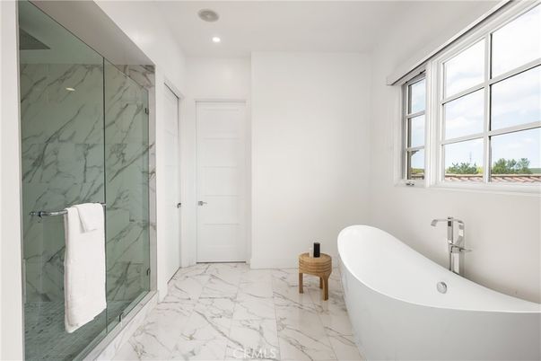 Bathroom, Free Standing Baths, Glass Shower, Interior, Marble, Marble Walls, Recessed Lighting