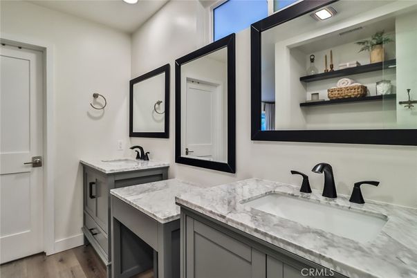 Bathroom, Dual Sink Vanities, Interior, Recessed Lighting, Wood Texture Flooring