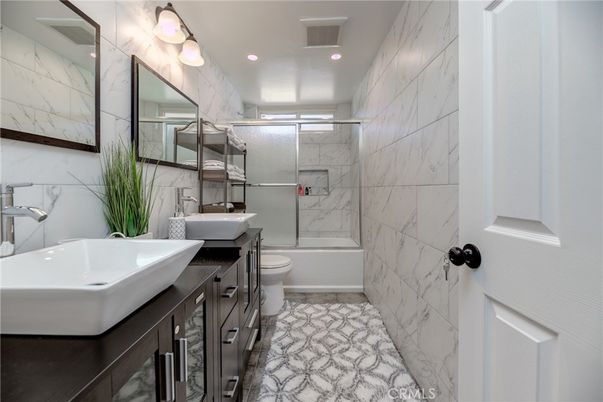 Bathroom, Dual Sink Vanities, Glass Shower, Interior, Marble Walls, Recessed Lighting